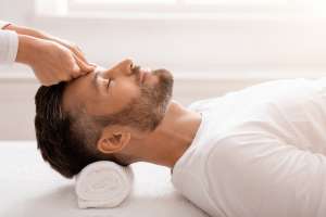 man having relaxing head massage